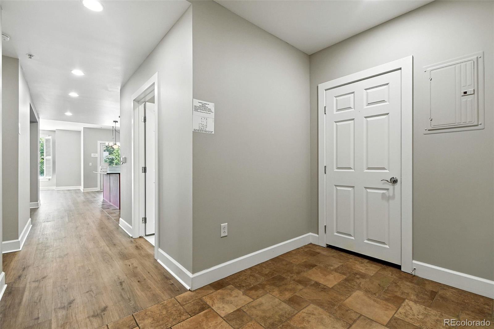 1631 Emerson Street, Unit 207 Denver, CO 80218 - Photo 25 of 32 a view of a hallway with wooden floor