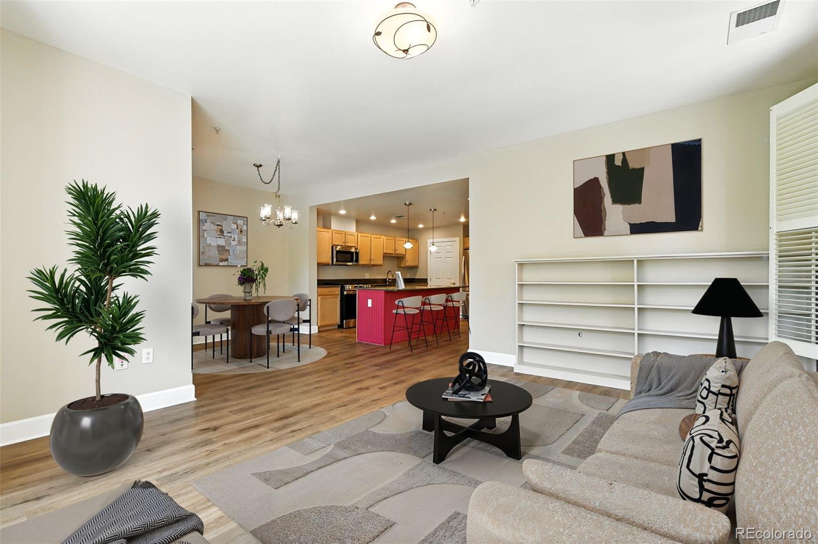 1631 Emerson Street, Unit 207 Denver, CO 80218 - Photo 4 of 31 a living room with furniture and a potted plant