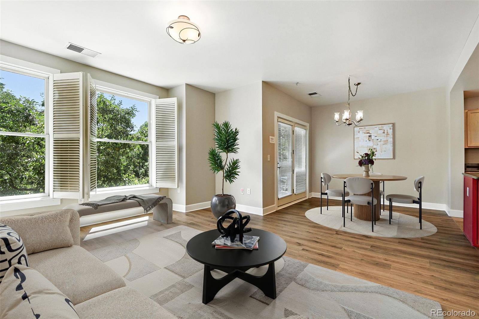 1631 Emerson Street, Unit 207 Denver, CO 80218 - Photo 5 of 31 a living room with furniture and a large window