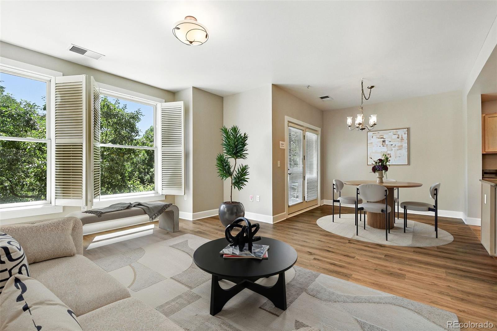 1631 Emerson Street, Unit 207 Denver, CO 80218 - Photo 5 of 30 a living room with furniture and a large window