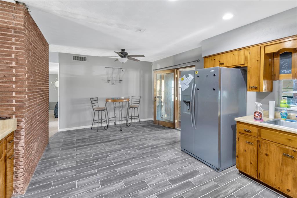 310 Kenmore Road Brandon, FL 33511 - Photo 6 of 33 a kitchen with stainless steel appliances a refrigerator and wooden floor