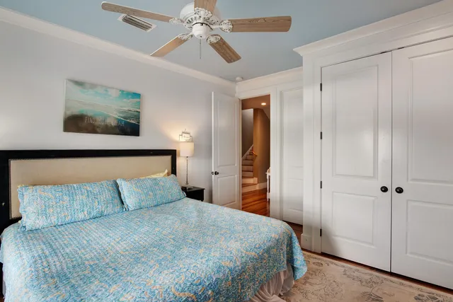 a bathroom with a toilet and a shower curtain