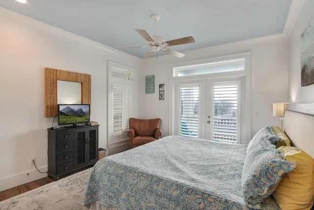 a bedroom with two beds and window