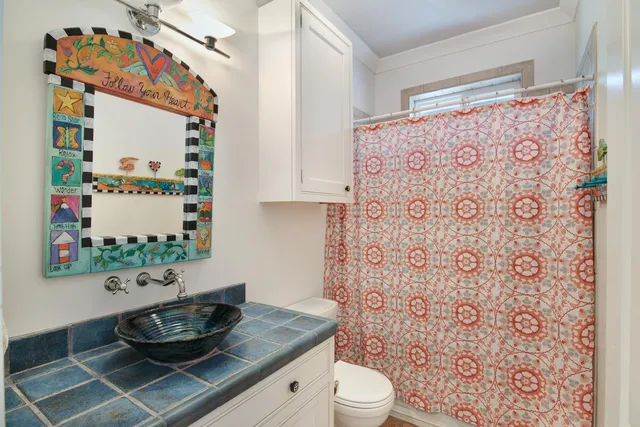 a very nice looking room with a large window and chandelier