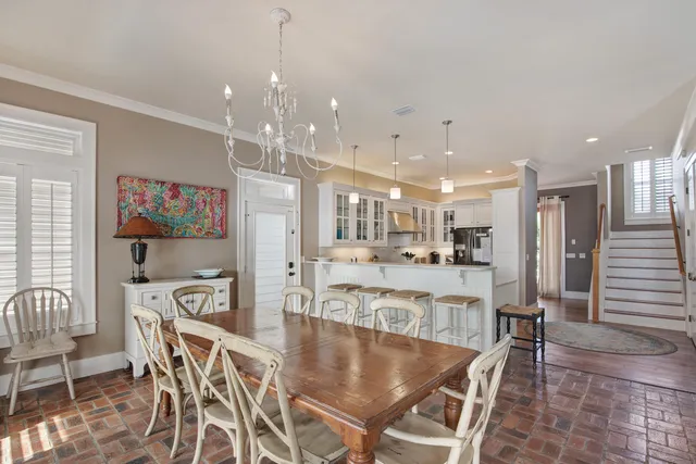 a large kitchen with kitchen island a table and chairs