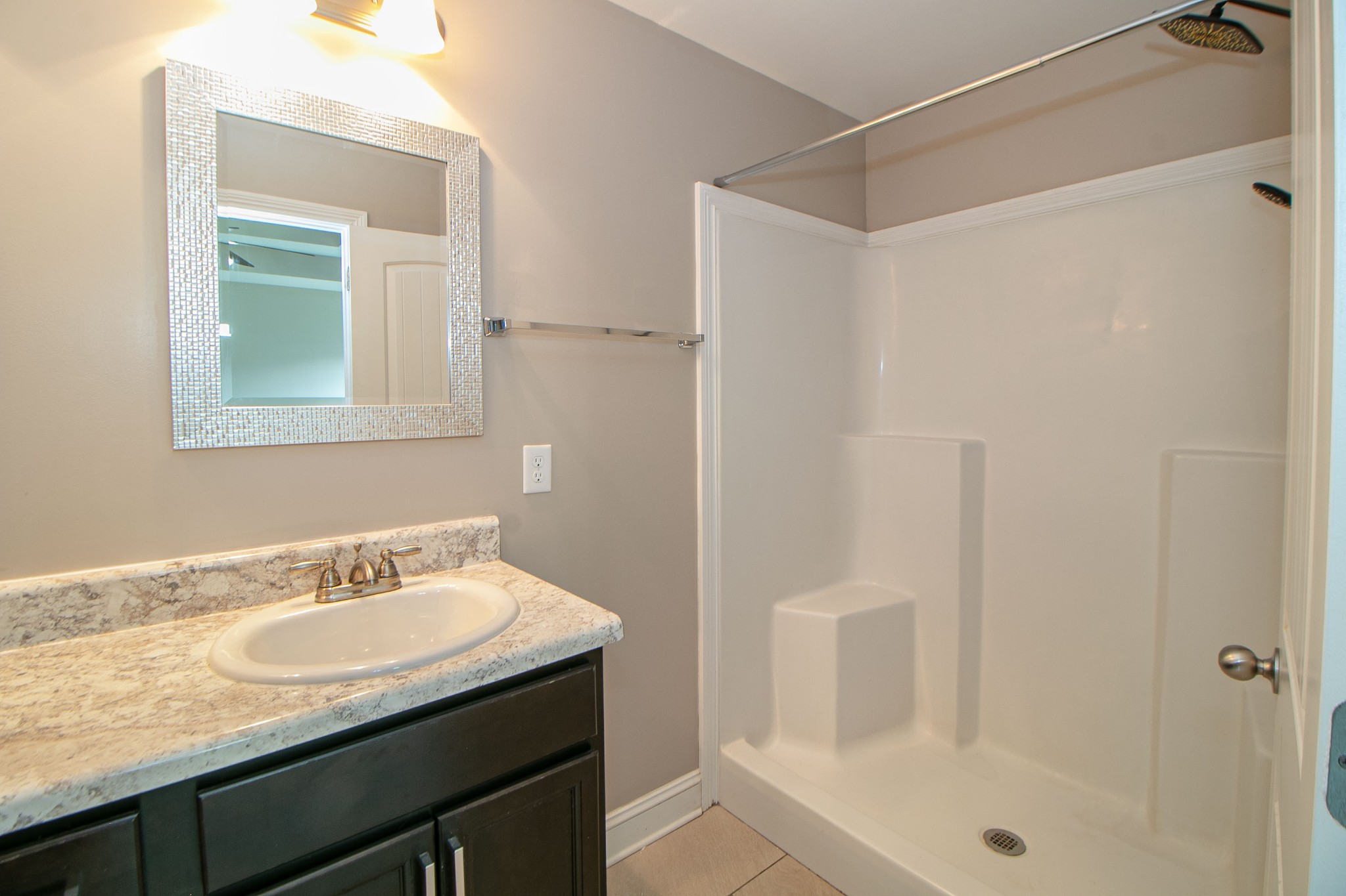 151 Ambridge Street Oak Grove, KY 42262 - Photo 17 of 30 a bathroom with a granite countertop sink a mirror and shower
