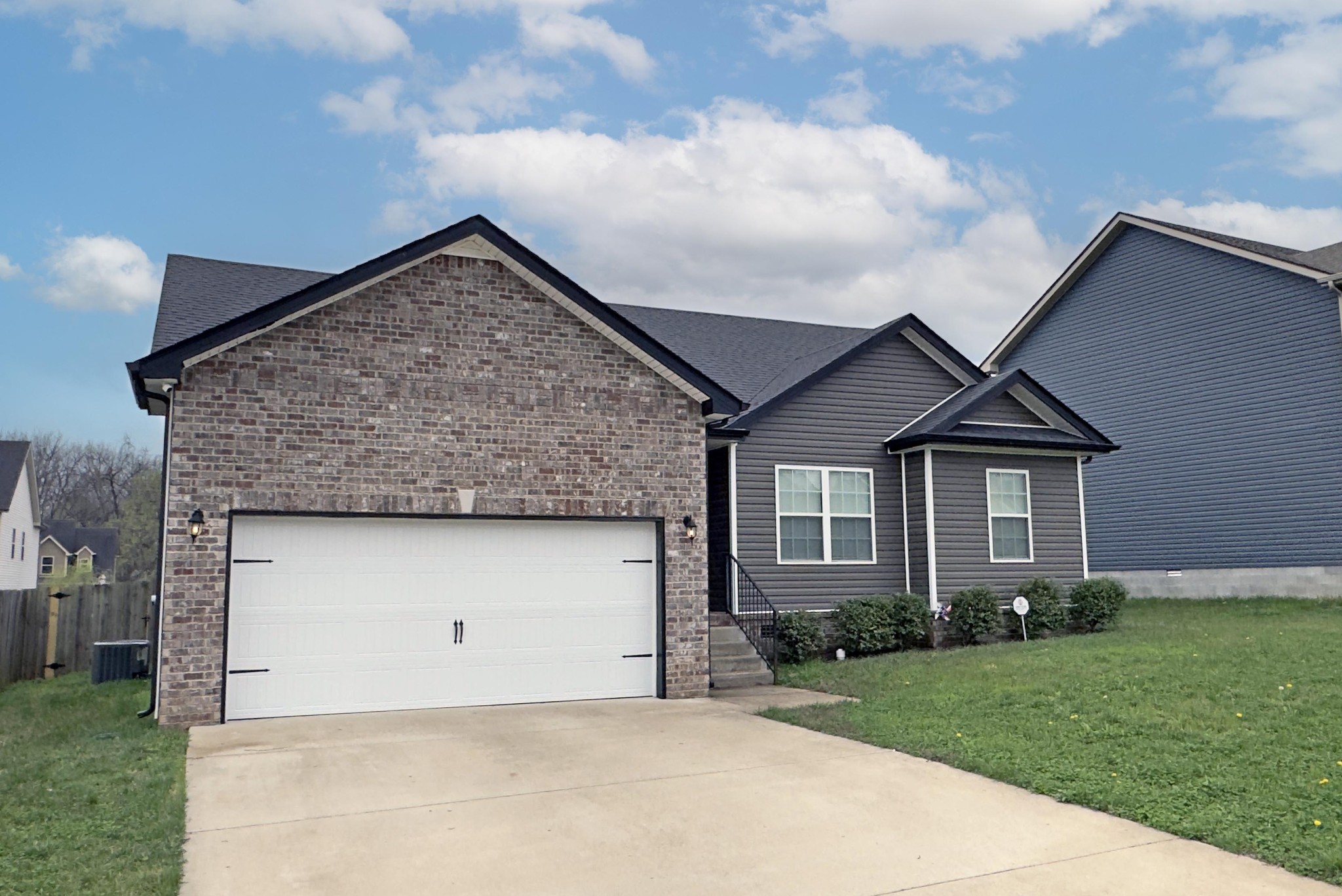 151 Ambridge Street Oak Grove, KY 42262 - Photo 2 of 30 a front view of a house with a yard and garage
