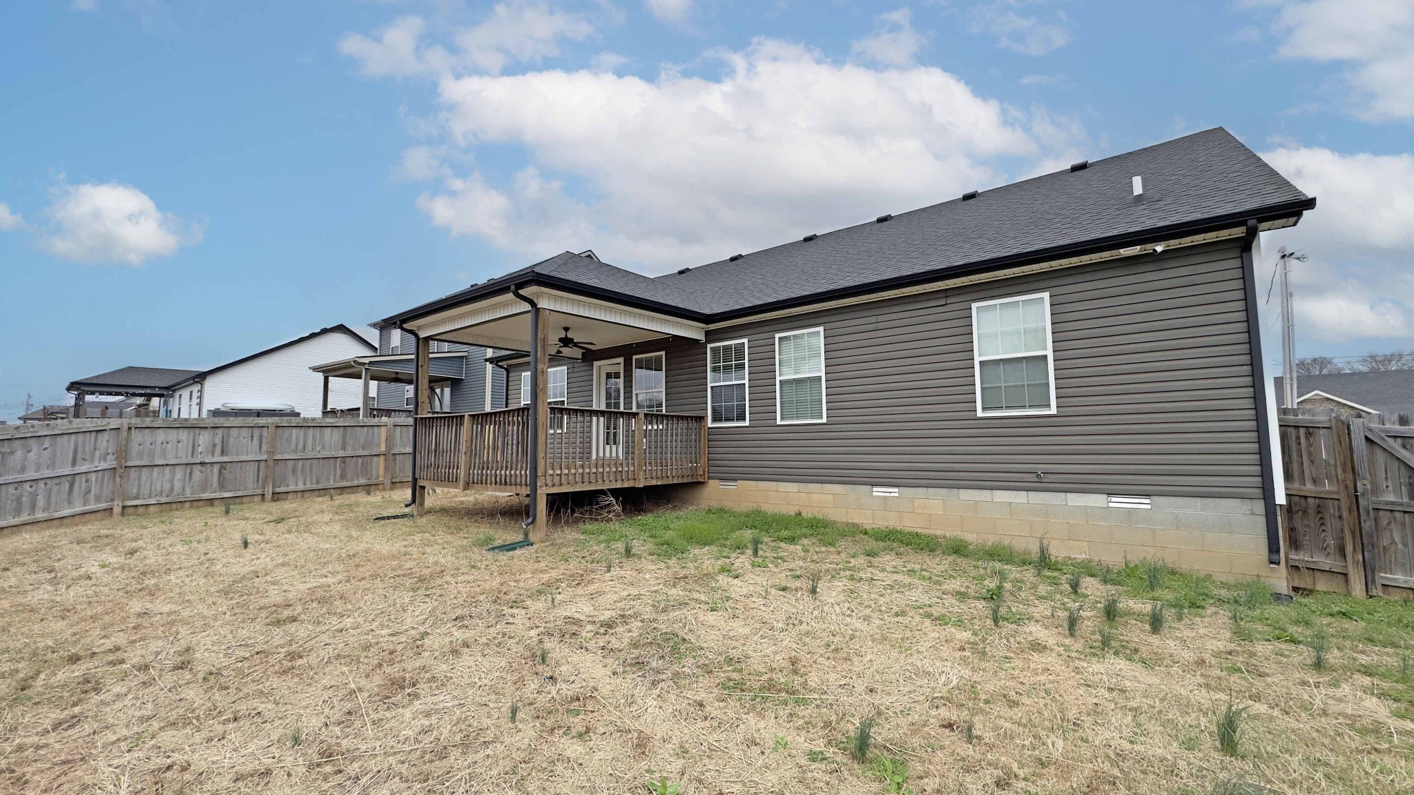 151 Ambridge Street Oak Grove, KY 42262 - Photo 28 of 30 a backyard of a house with wooden fence and porch