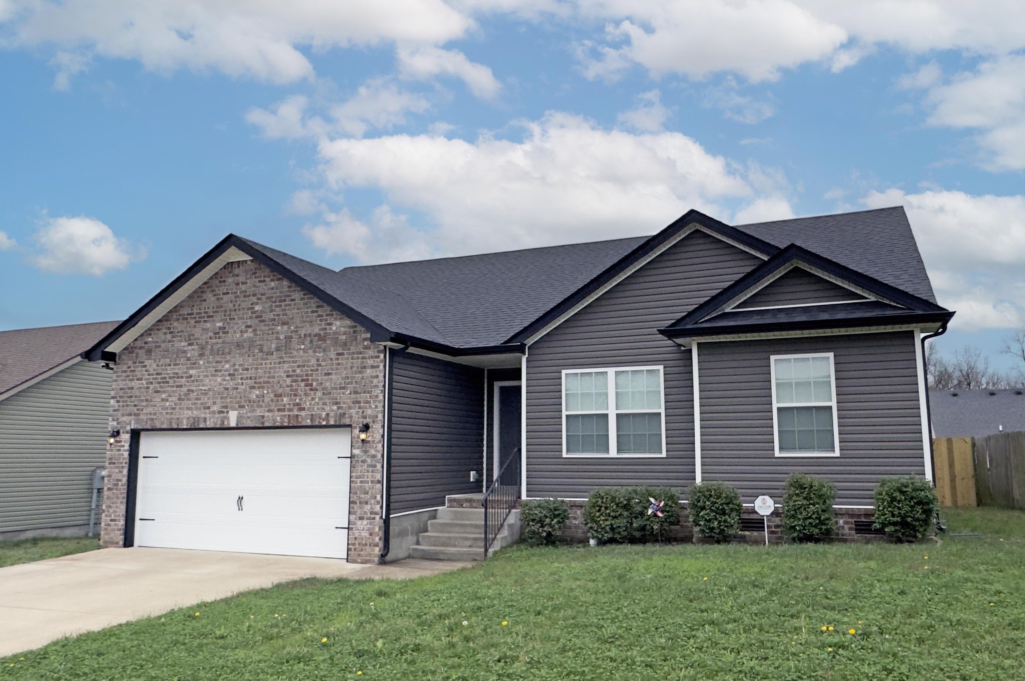 151 Ambridge Street Oak Grove, KY 42262 - Photo 3 of 30 a front view of a house with a garden and yard