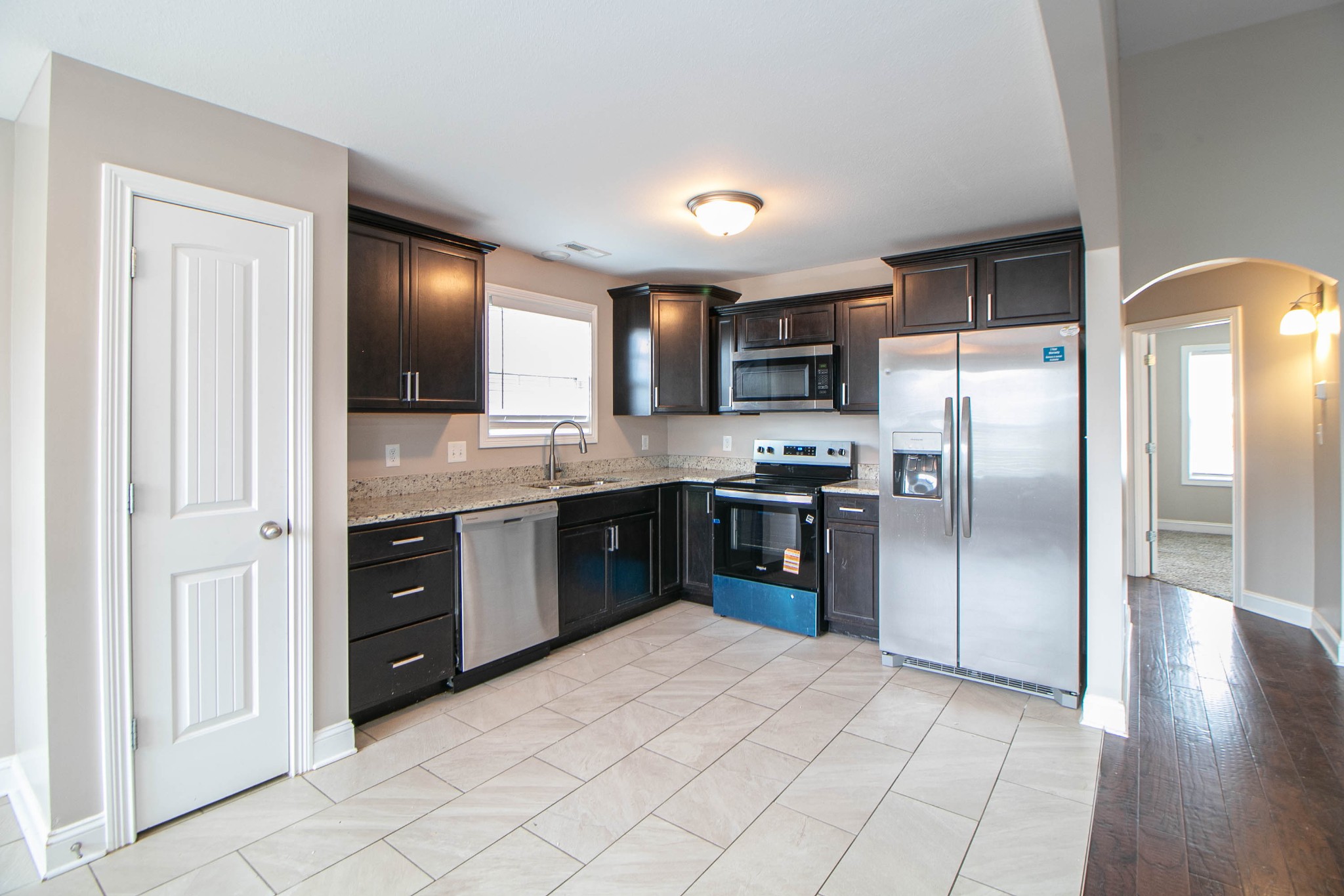 151 Ambridge Street Oak Grove, KY 42262 - Photo 8 of 30 a large kitchen with cabinets and stainless steel appliances