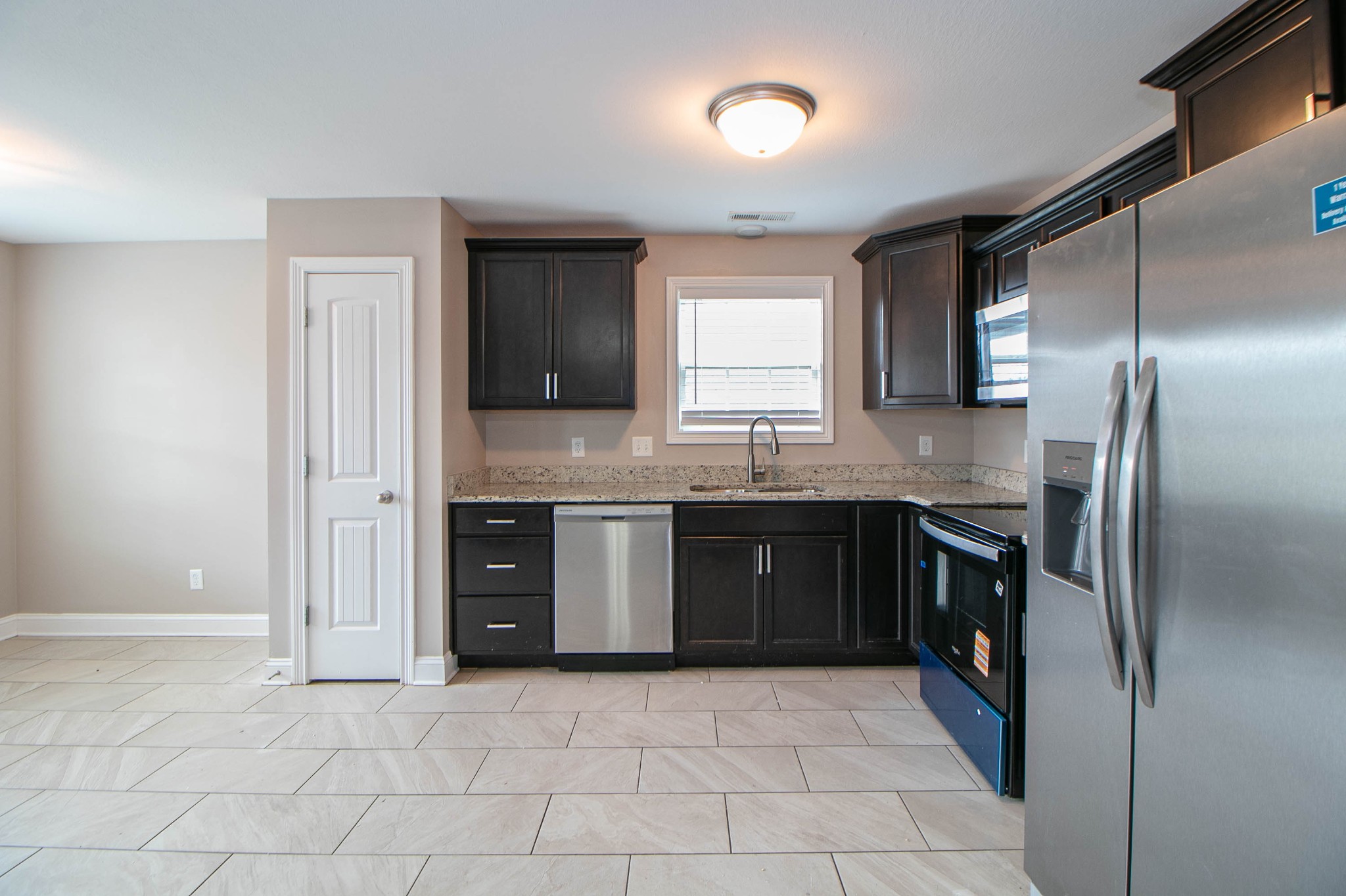151 Ambridge Street Oak Grove, KY 42262 - Photo 9 of 30 a large kitchen with stainless steel appliances granite countertop a refrigerator and a sink