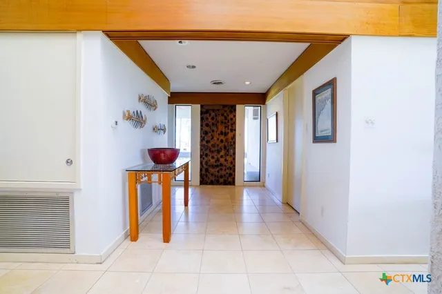 a view of a patio with dining table and chairs