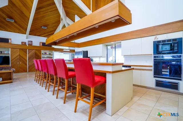 a view of a chairs and table in the patio