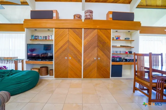 a view of a balcony with wooden floor
