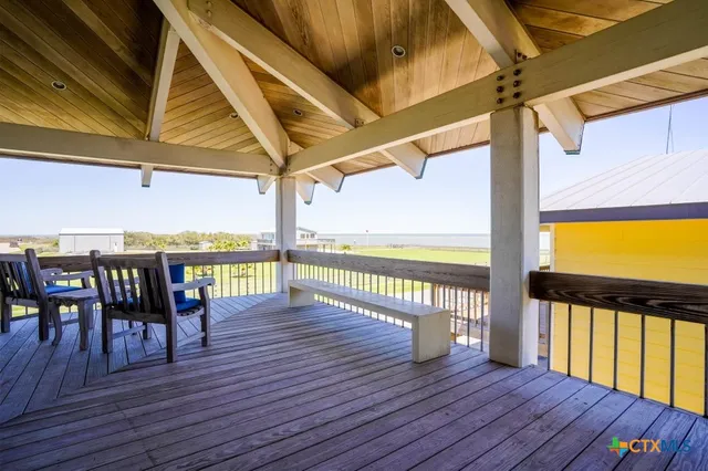 a bedroom with a bed and a chair