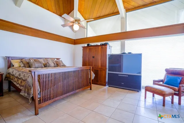 a white toilet sitting next to a bathroom sink and a window