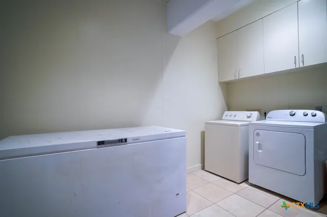 a bedroom with bed and a couch