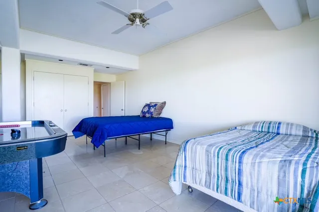 a bedroom with a bed and a table