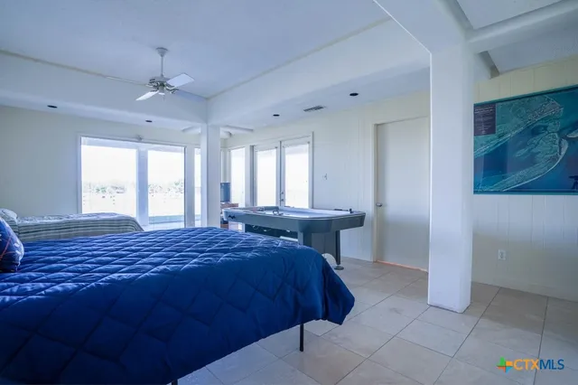 a white toilet sitting next to a shower