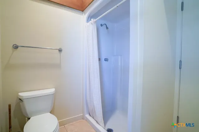 an aerial view of a house with a swimming pool