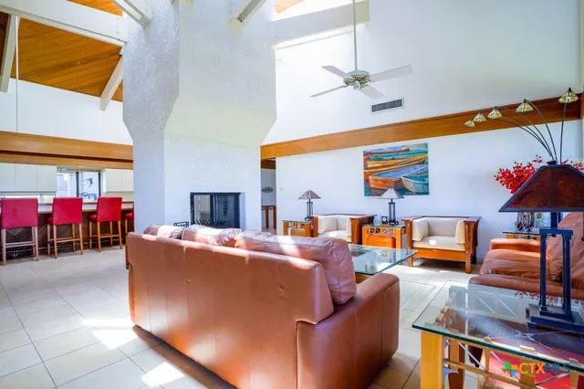 an aerial view of a house with a swimming pool