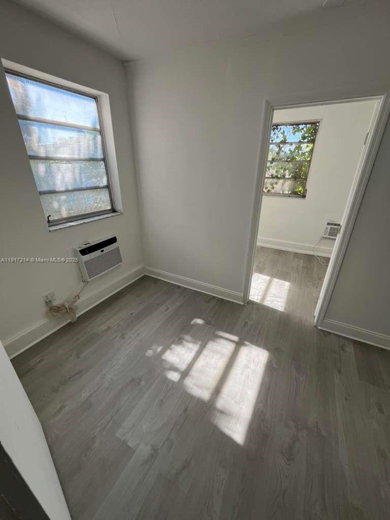 1560 Southwest 5th Street, Unit 11 Miami, FL 33135 - Photo 12 of 12 an empty room with windows