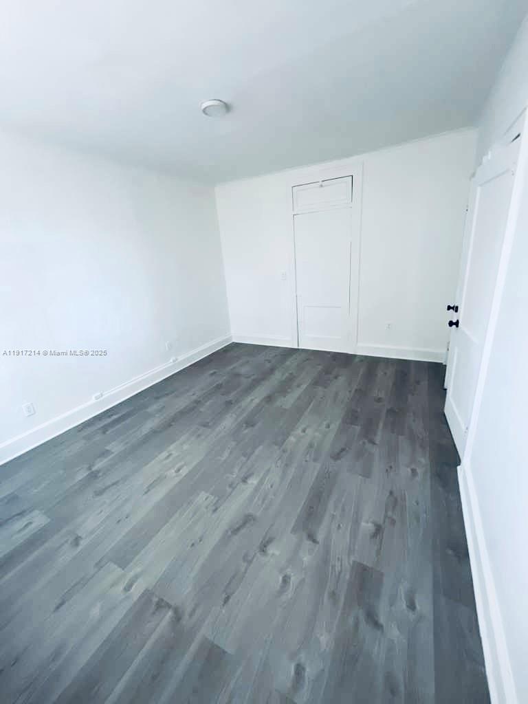 1560 Southwest 5th Street, Unit 11 Miami, FL 33135 - Photo 6 of 12 a view of a room with wooden floor