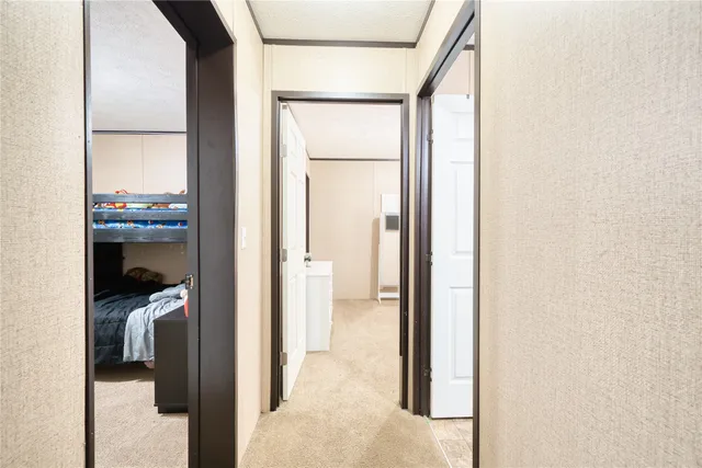 a view of a bedroom from a hallway