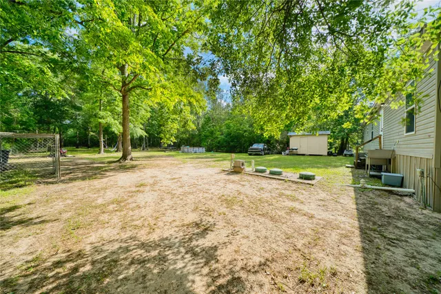 a view of a basketball area with green space