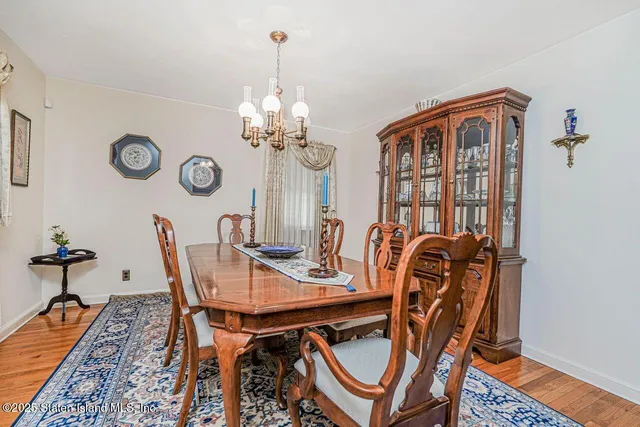 a bedroom with a bed a dresser and dresser