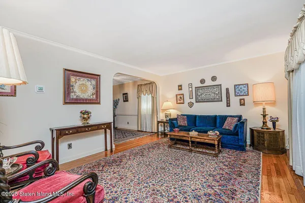 a living room with furniture and a rug