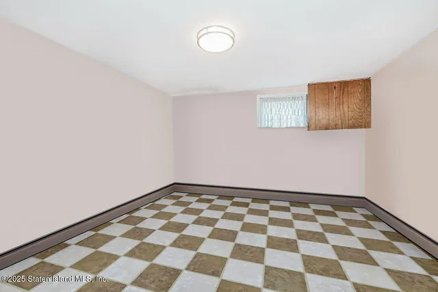 a living room with furniture and a book shelf
