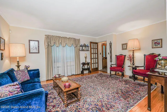 a living room with furniture and a rug