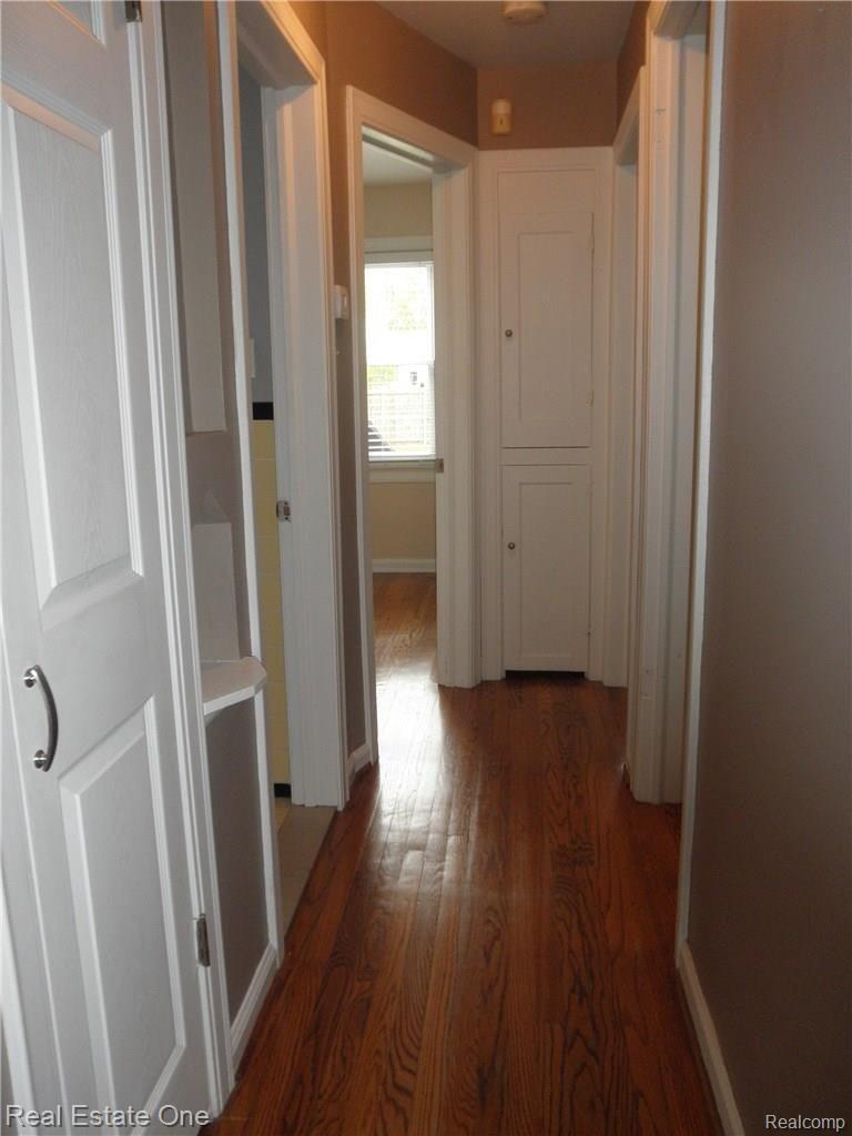960 Cambridge Road Berkley, MI 48072 - Photo 15 of 30 Hallway showcasing hardwood floor, built in cabinetry and new doors