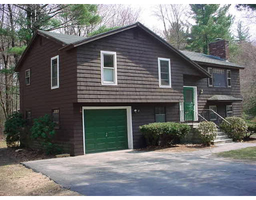 24 Cathy Road Chelmsford, MA 01824 - Photo 1 of 1 a front view of a house with a yard and garage