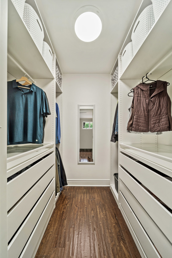 28W140 Mack Road Wheaton, IL 60189 - Photo 24 of 48 a view of walk in closet with clothes and shoes