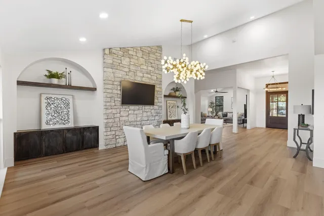 a kitchen with stove a sink and cabinets
