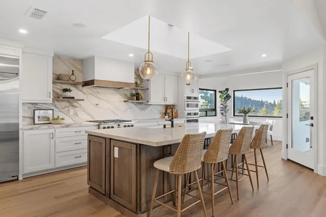 a bedroom with a bed flat screen tv and a couch