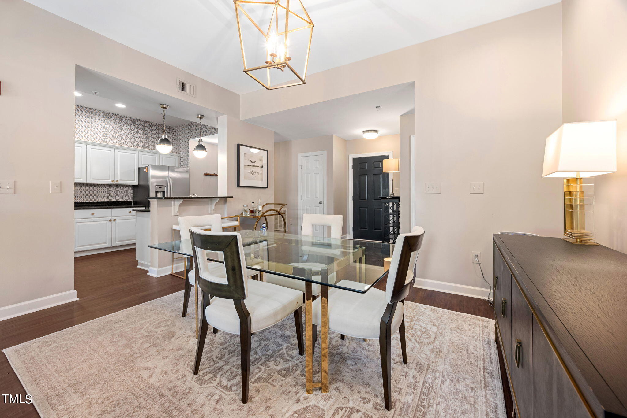 200 South Dawson Street, Unit 201 Raleigh, NC 27601 - Photo 14 of 39 a view of a dining room with furniture and a chandelier