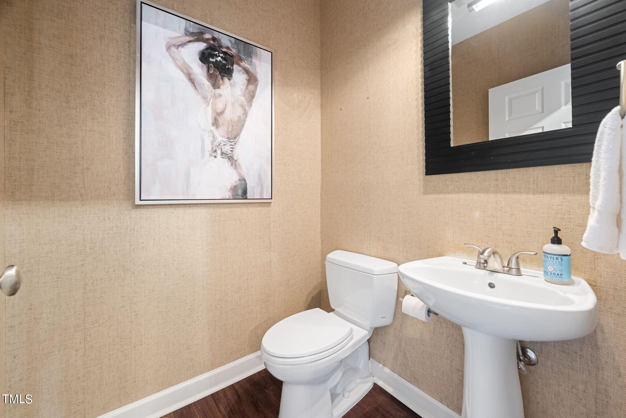 200 South Dawson Street, Unit 201 Raleigh, NC 27601 - Photo 15 of 39 a bathroom with a toilet sink and mirror