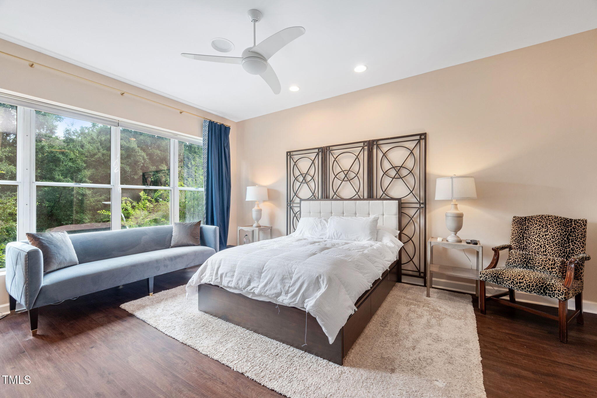 200 South Dawson Street, Unit 201 Raleigh, NC 27601 - Photo 20 of 39 a bedroom with a bed couch and a large window