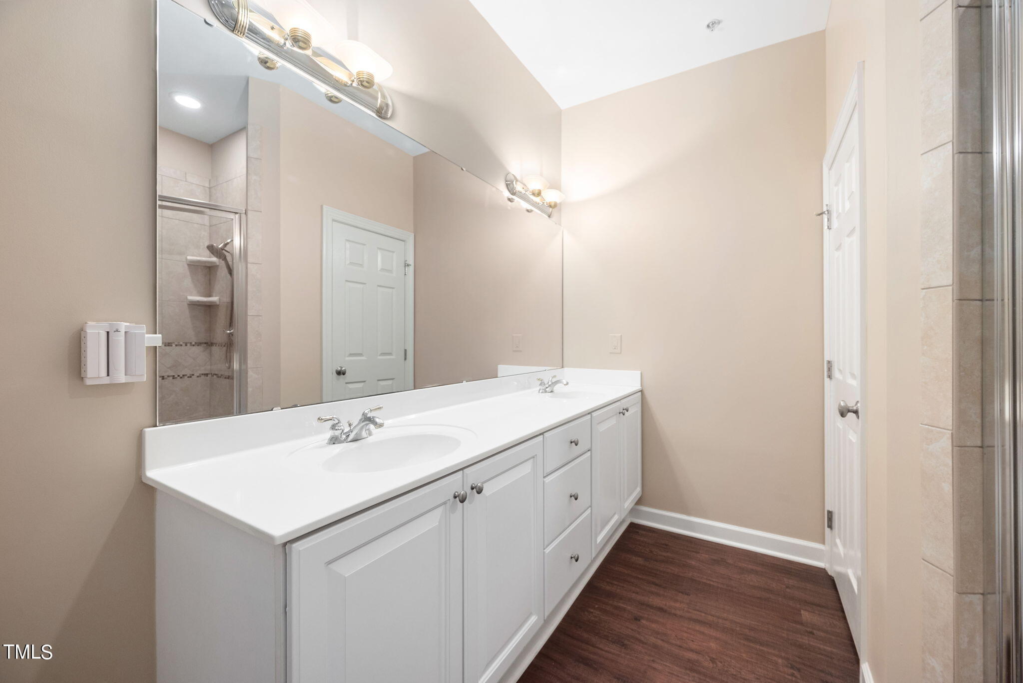 200 South Dawson Street, Unit 201 Raleigh, NC 27601 - Photo 24 of 39 a bathroom with a sink and a mirror