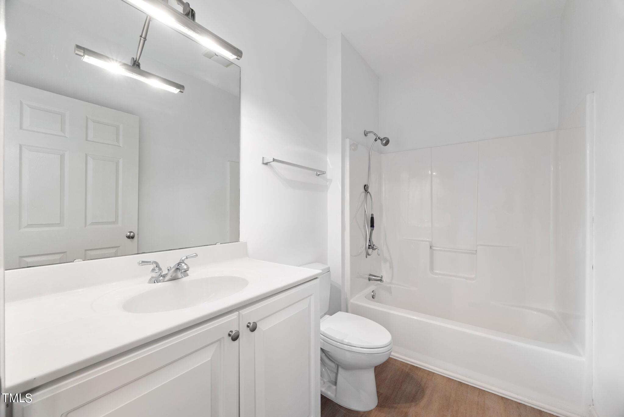200 South Dawson Street, Unit 201 Raleigh, NC 27601 - Photo 27 of 39 a bathroom with a sink a toilet and shower