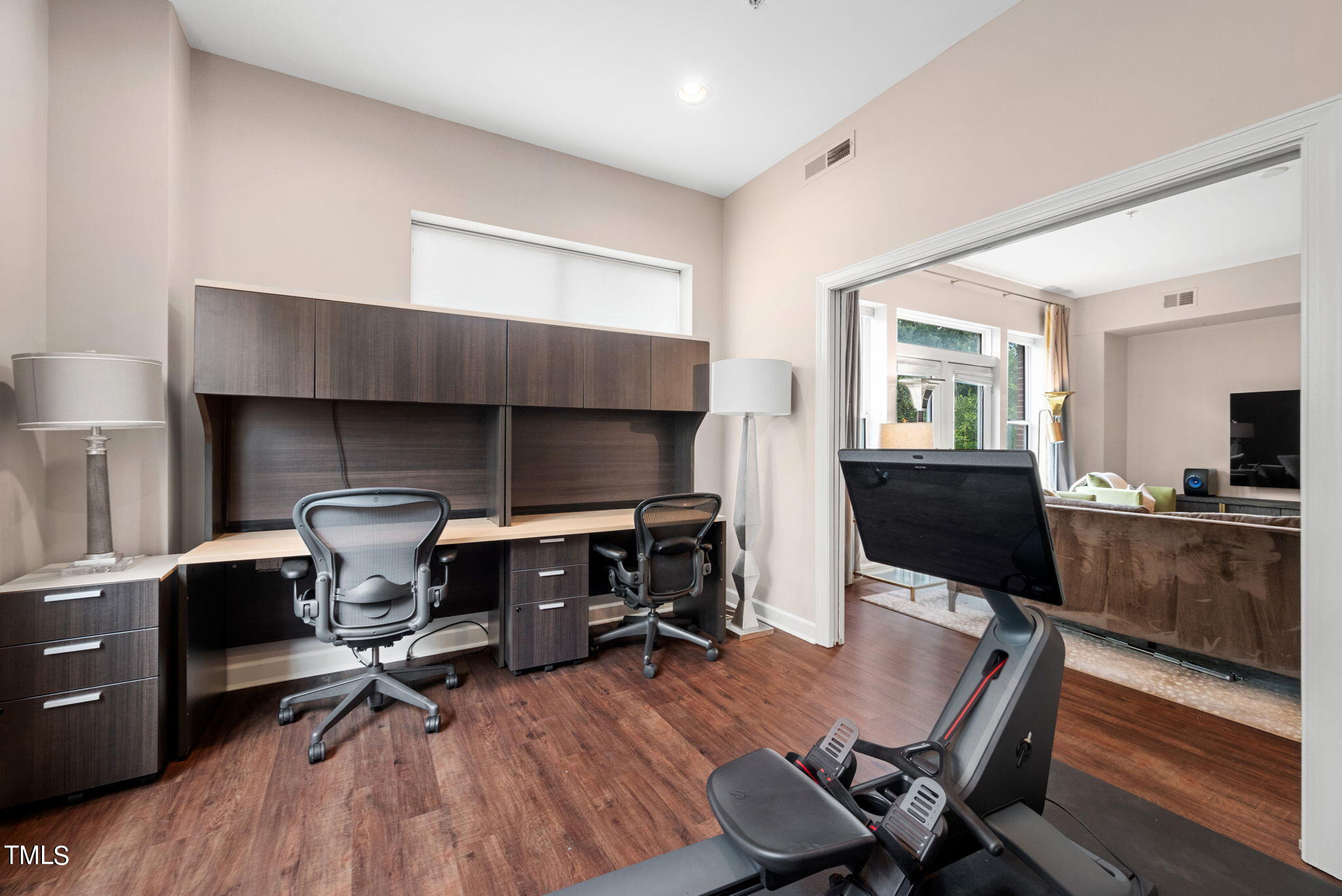 200 South Dawson Street, Unit 201 Raleigh, NC 27601 - Photo 30 of 39 a workspace with furniture and wooden floor