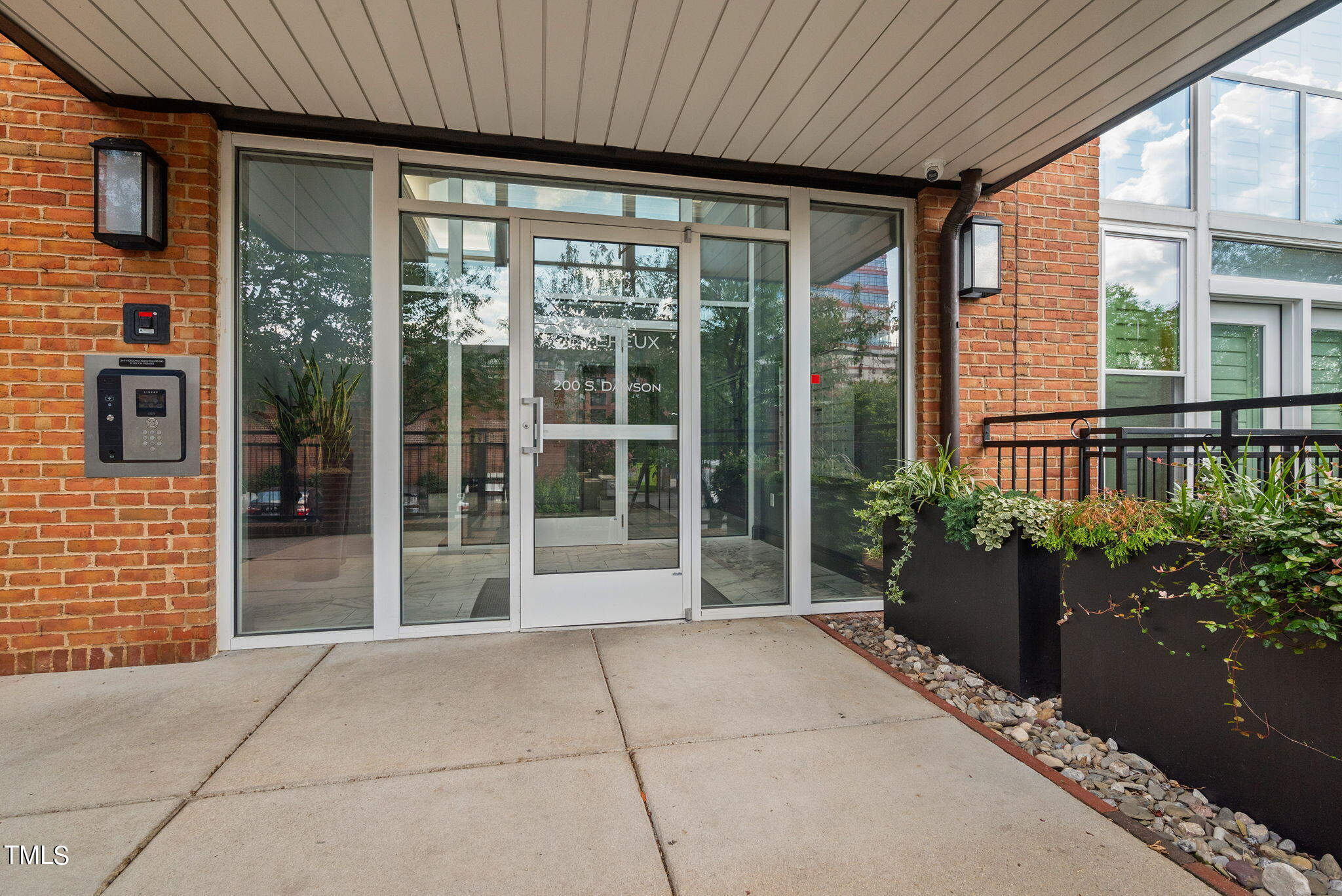 200 South Dawson Street, Unit 201 Raleigh, NC 27601 - Photo 4 of 39 a view of a house with a garden