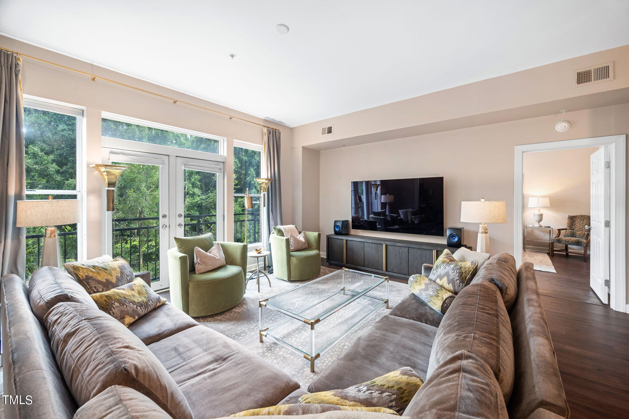 200 South Dawson Street, Unit 201 Raleigh, NC 27601 - Photo 10 of 39 a living room with furniture and a flat screen tv