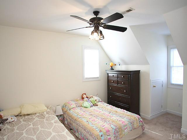 2504 Barton Ridge Court Raleigh, NC 27613 - Photo 15 of 25 This bedroom, is large and fits 2 beds, along with carpeting, a ceiling fan and natural lighting pouring through the windows. Bedroom