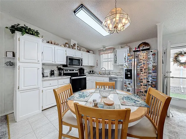 a view of a dining room with furniture large window and wooden floor