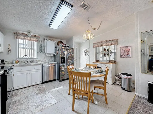 a view of a dining room kitchen and a window