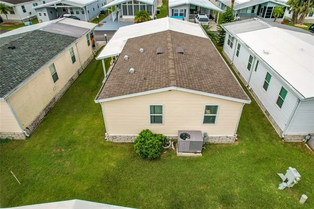a aerial view of a house with swimming pool